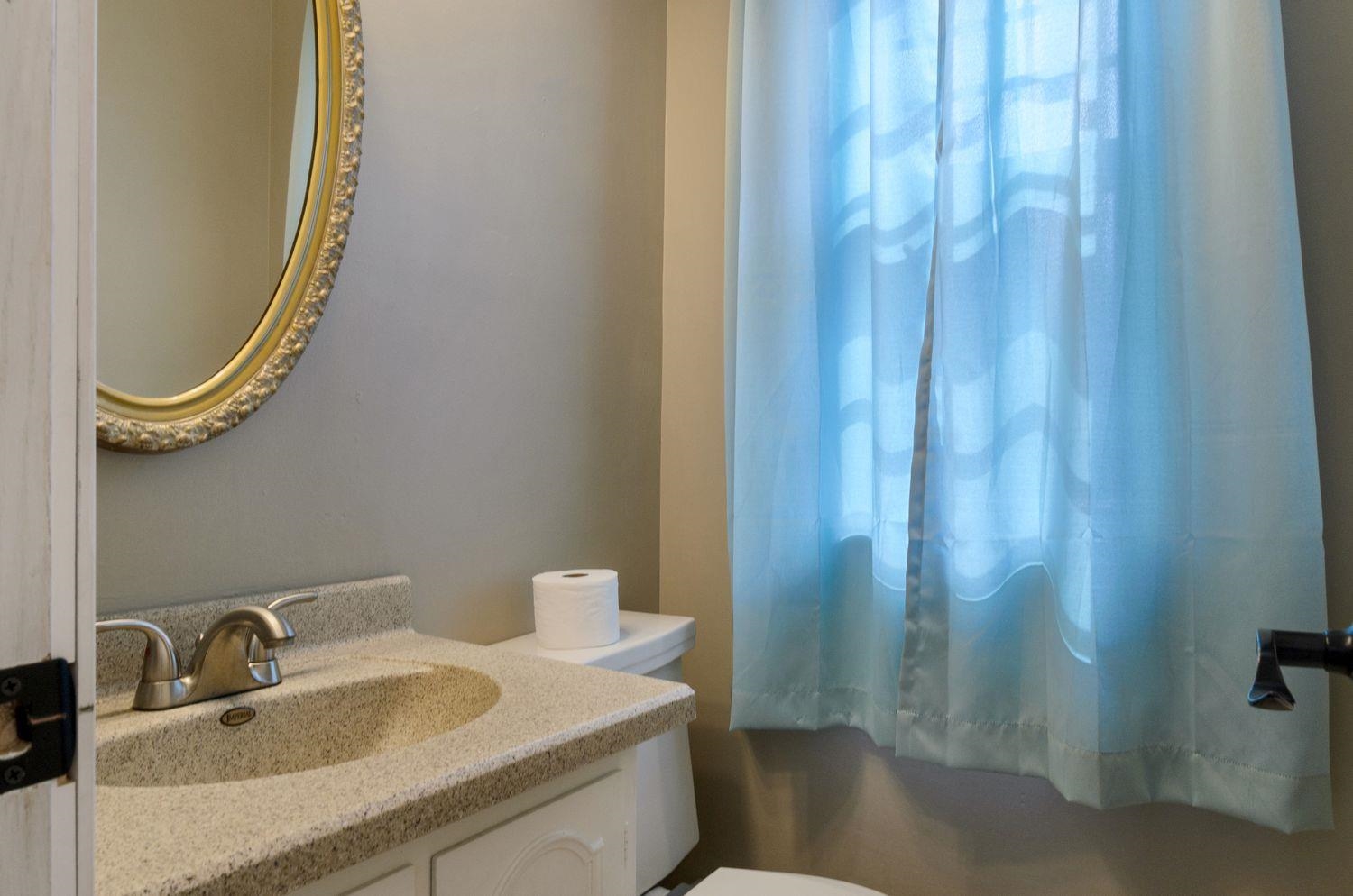 736 East 3rd Street Dixon, IL 61021 - Photo 13 of 29 a bathroom with a sink and a mirror