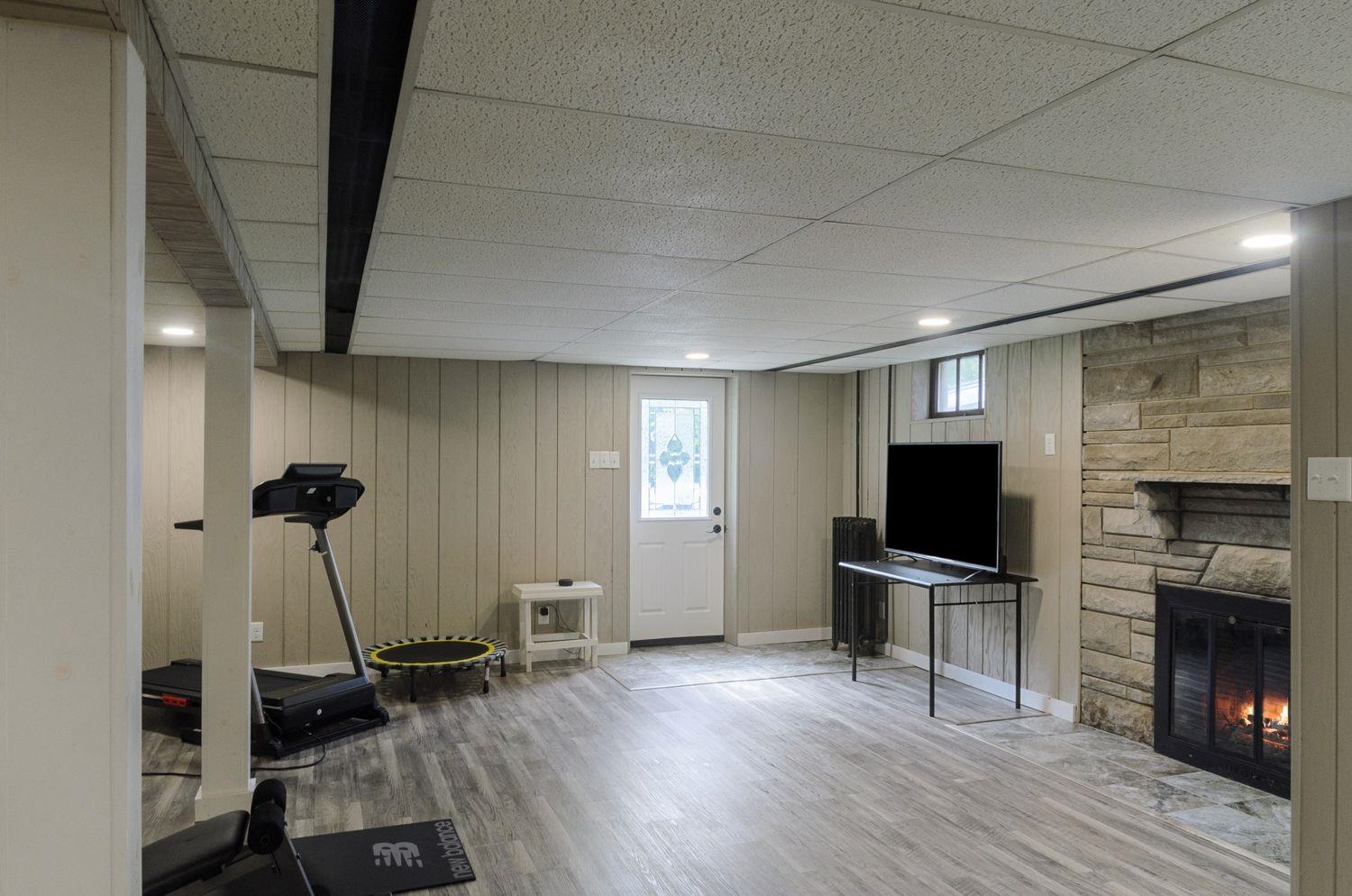 736 East 3rd Street Dixon, IL 61021 - Photo 22 of 29 a view of a room with gym equipment and a flat screen tv