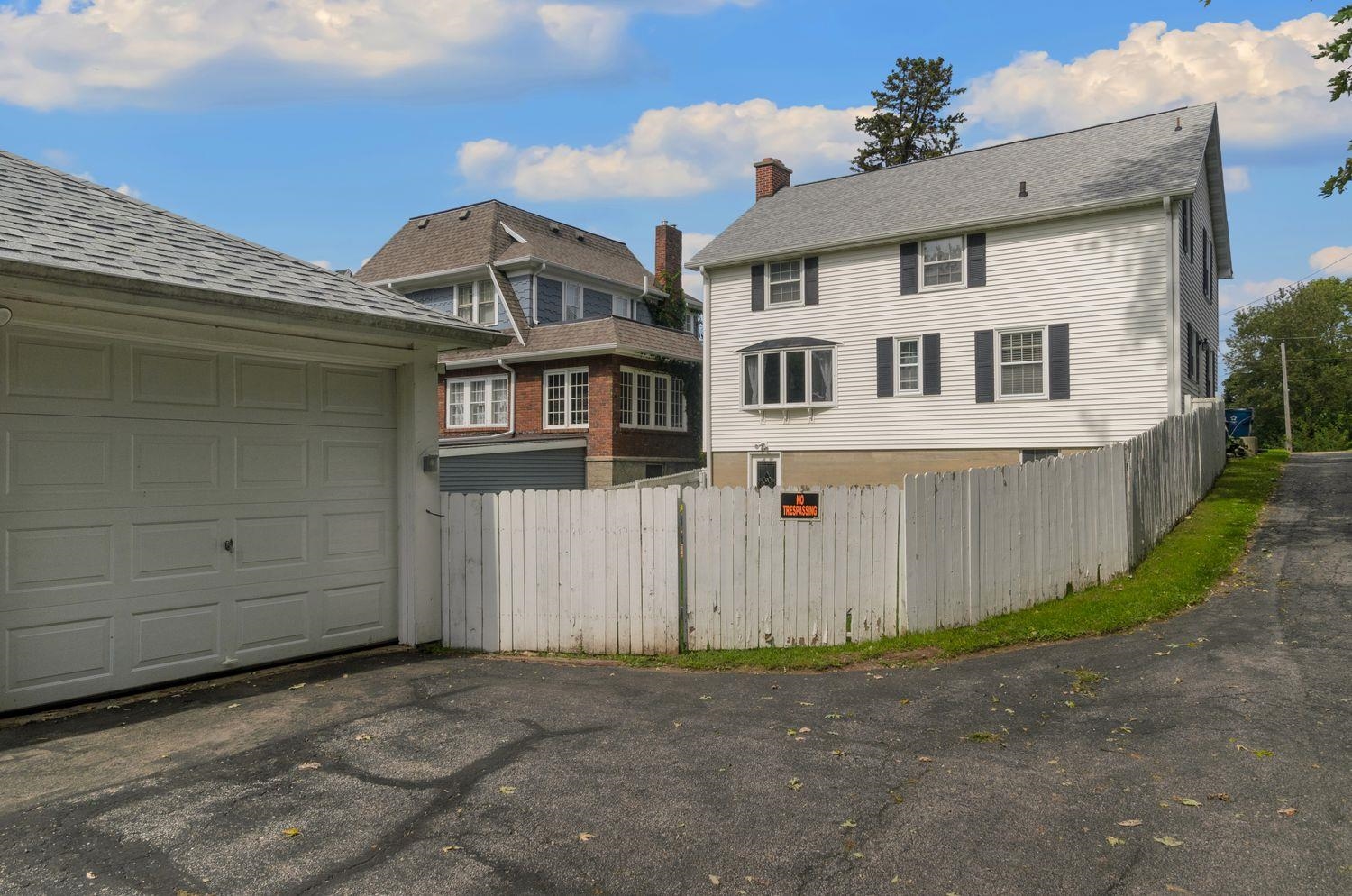 736 East 3rd Street Dixon, IL 61021 - Photo 26 of 29 a view of a white house with large windows