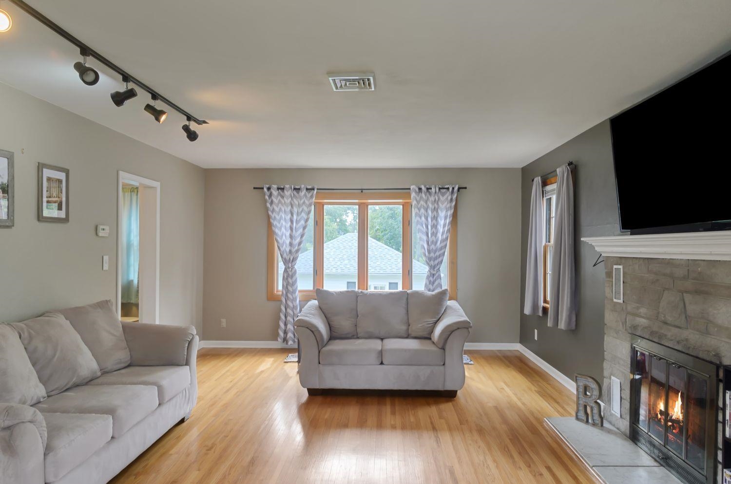 736 East 3rd Street Dixon, IL 61021 - Photo 7 of 29 a living room with furniture and a flat screen tv