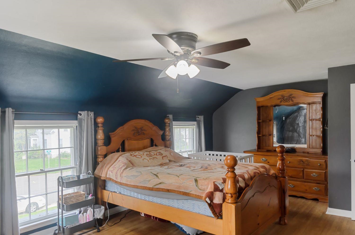 736 East 3rd Street Dixon, IL 61021 - Photo 10 of 29 a bedroom with a bed and dresser with mirror