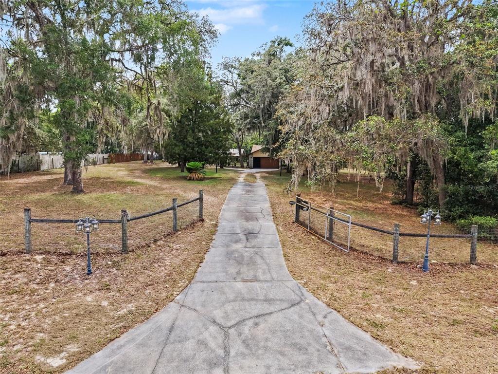 7111 Ricker Avenue Webster, FL 33597 - Photo 2 of 41 a view of pathway with yard