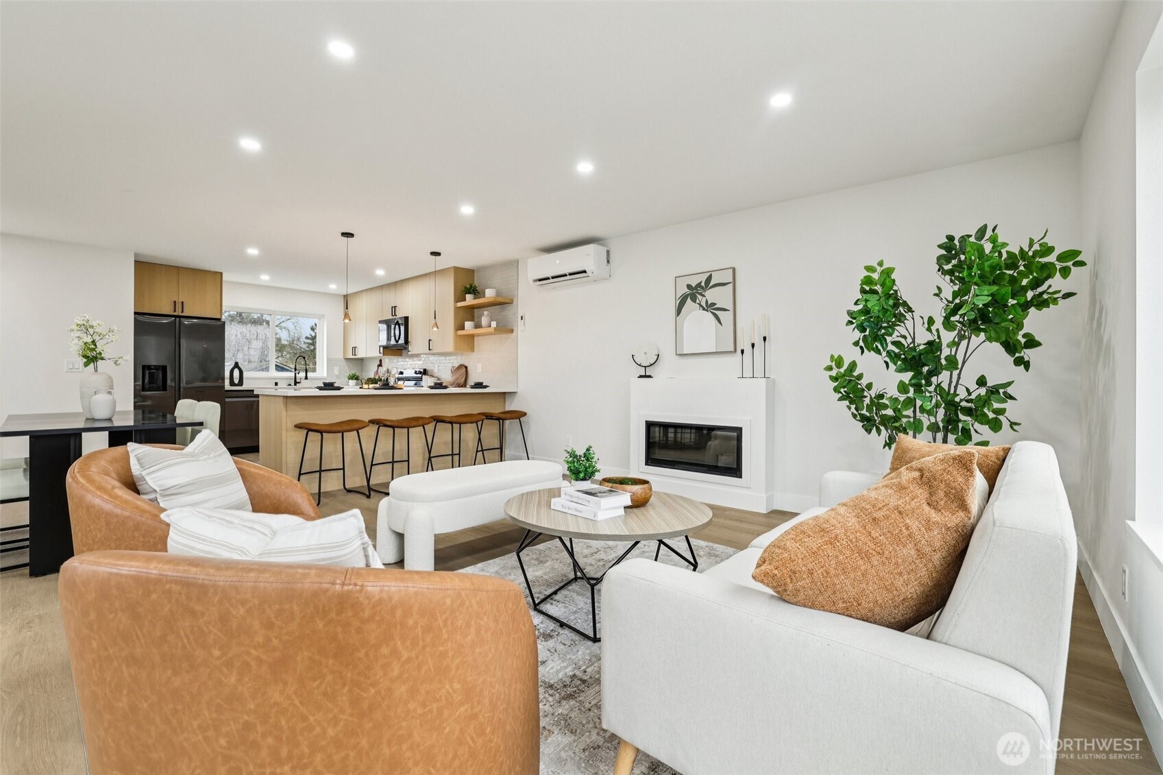 7719 Renton Avenue South, Unit A Seattle, WA 98118 - Photo 11 of 35 a living room with fireplace furniture and a kitchen