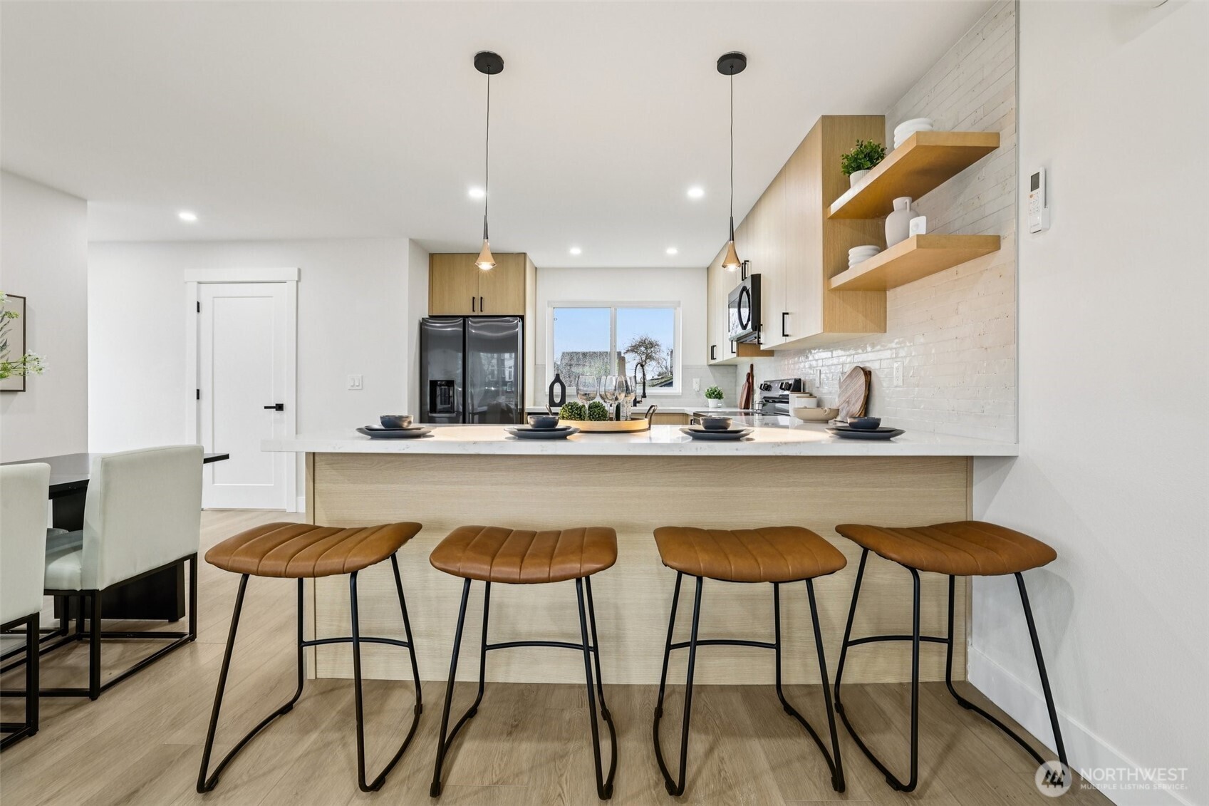 7719 Renton Avenue South, Unit A Seattle, WA 98118 - Photo 15 of 35 a view of kitchen with furniture and wooden floor