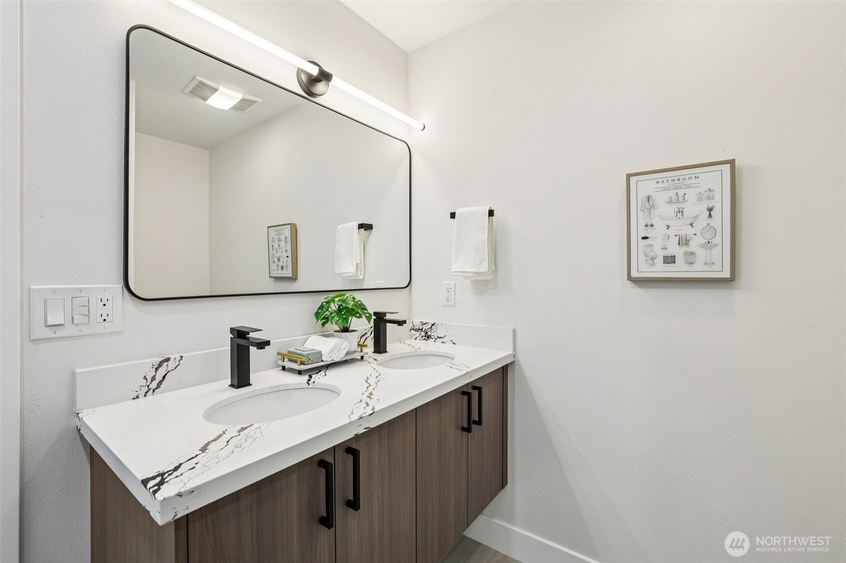 7719 Renton Avenue South, Unit A Seattle, WA 98118 - Photo 26 of 35 a bathroom with a sink and a mirror