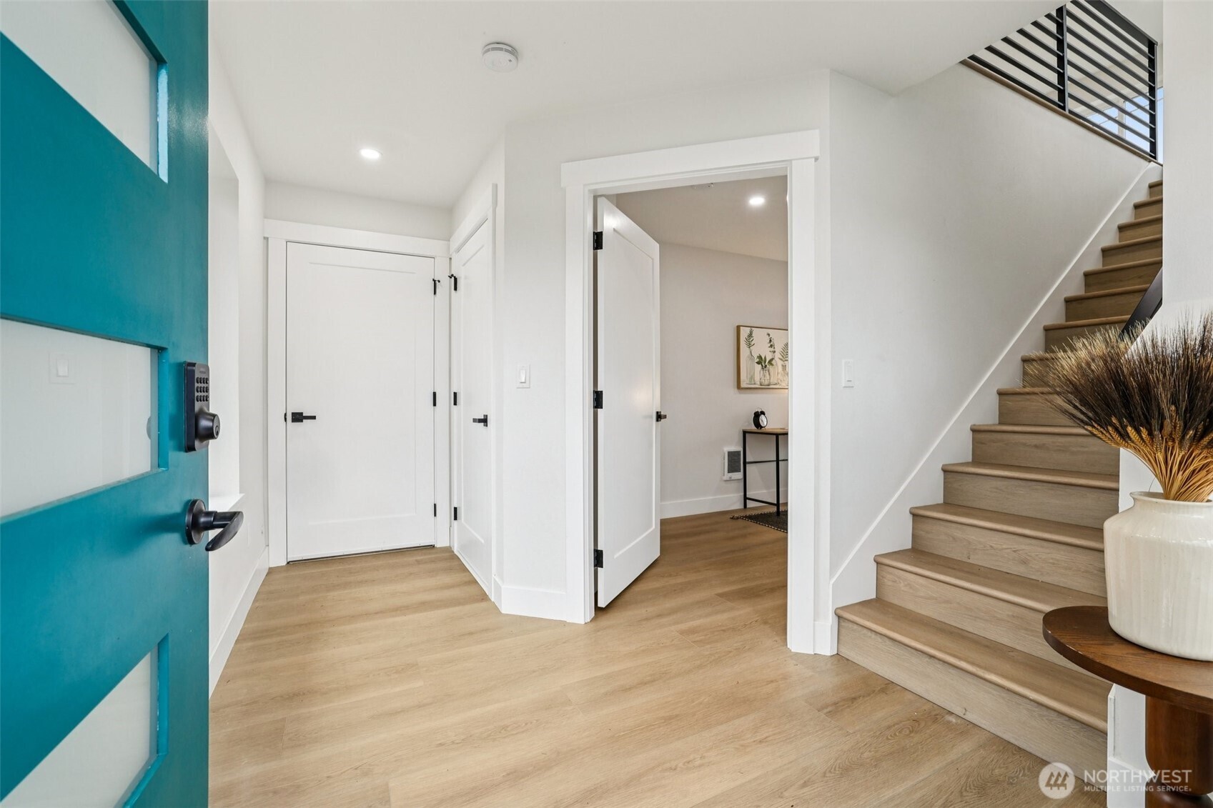 7719 Renton Avenue South, Unit A Seattle, WA 98118 - Photo 6 of 35 a view of a hallway with wooden floor and entryway