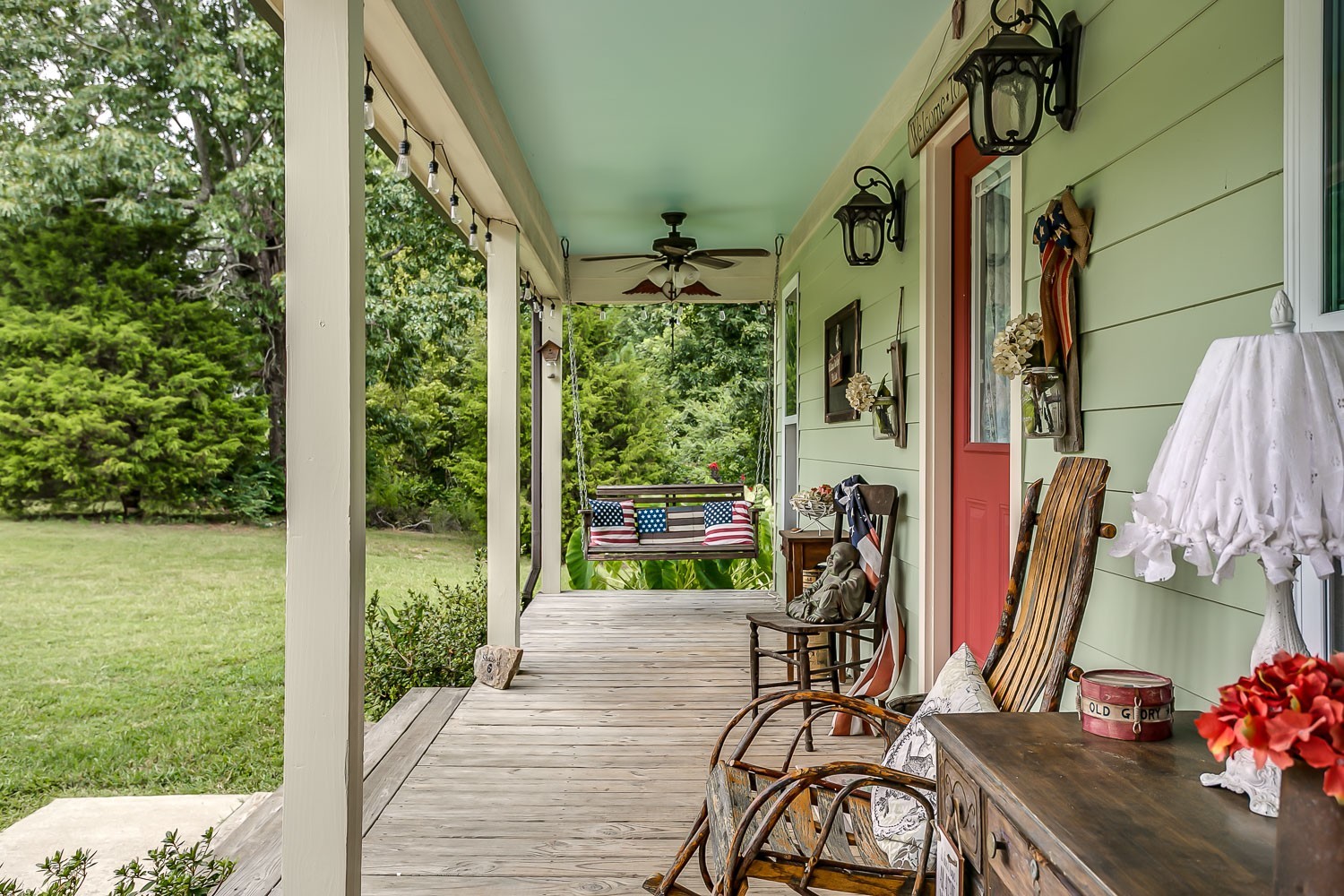 5620 Hargrove Road Franklin, TN 37064 - Photo 5 of 49 a view of a porch with wooden floor and a potted plant