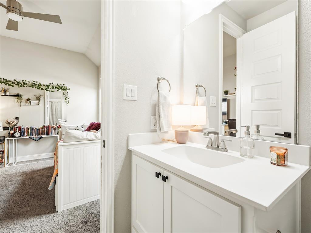 15340 Crape Myrtle Road Frisco, TX 75035 - Photo 35 of 40 White vanity with shaker-style cabinetry, a white countertop, and a single basin sink
