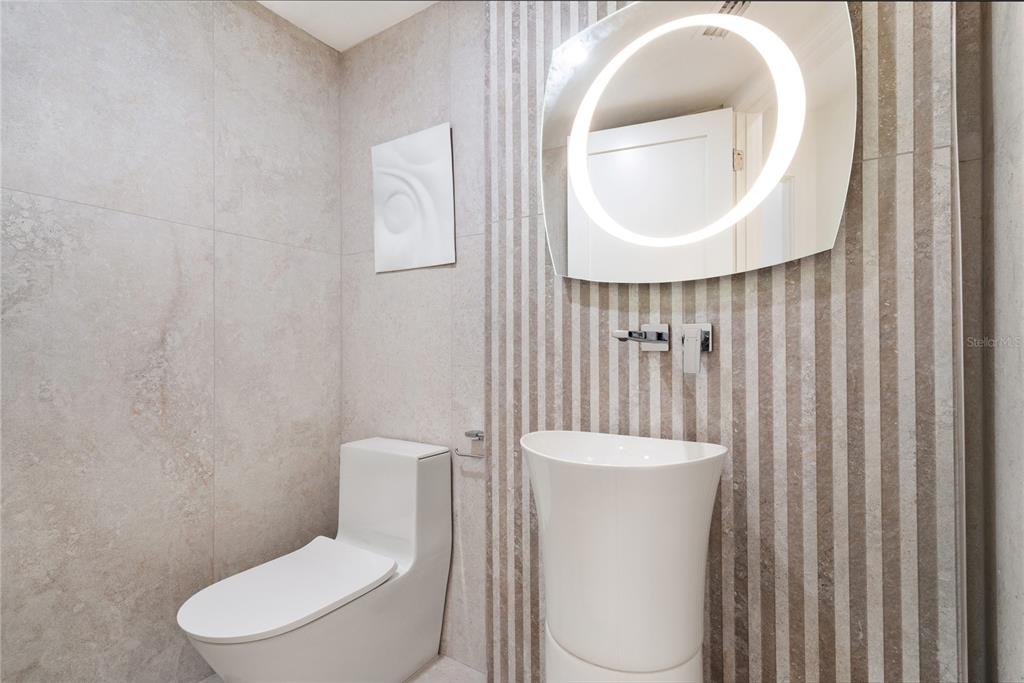 519 Rountree Drive Longboat Key, FL 34228 - Photo 35 of 88 a white toilet sitting next to a bathroom sink