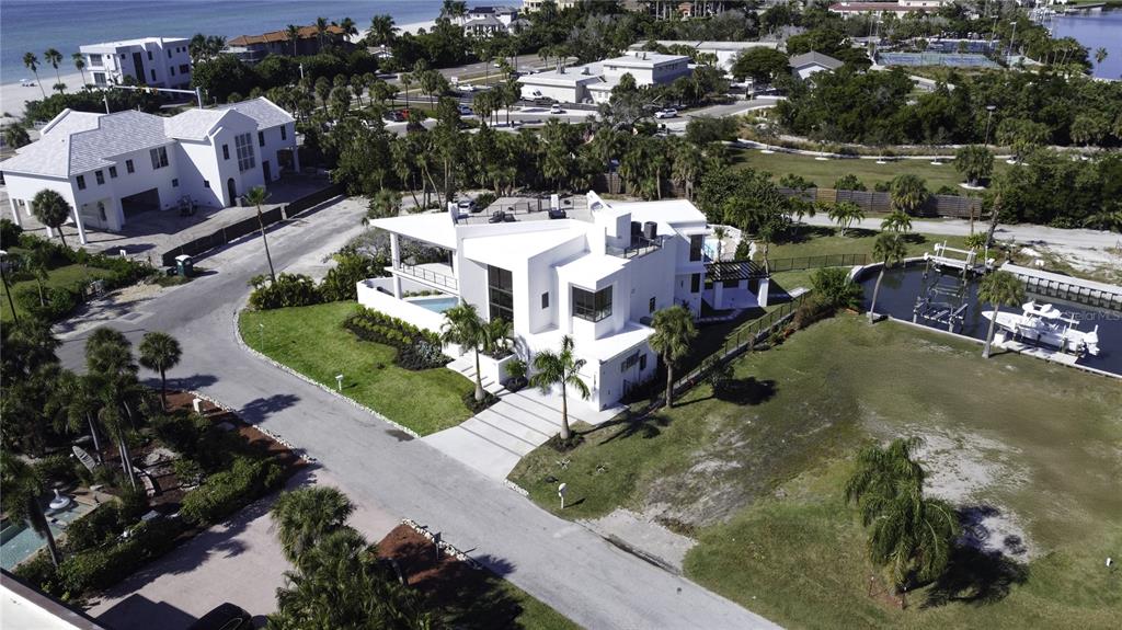 519 Rountree Drive Longboat Key, FL 34228 - Photo 75 of 88 an aerial view of a house with yard swimming pool and outdoor seating