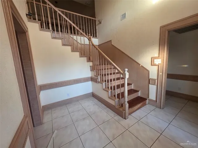 a view of staircase with white walls and white floor