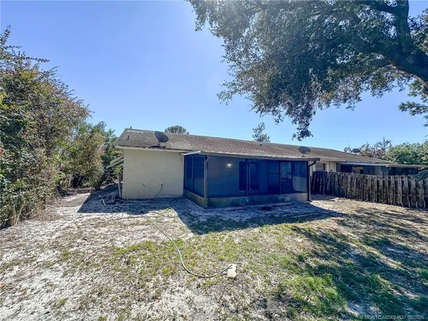 a view of a backyard of the house