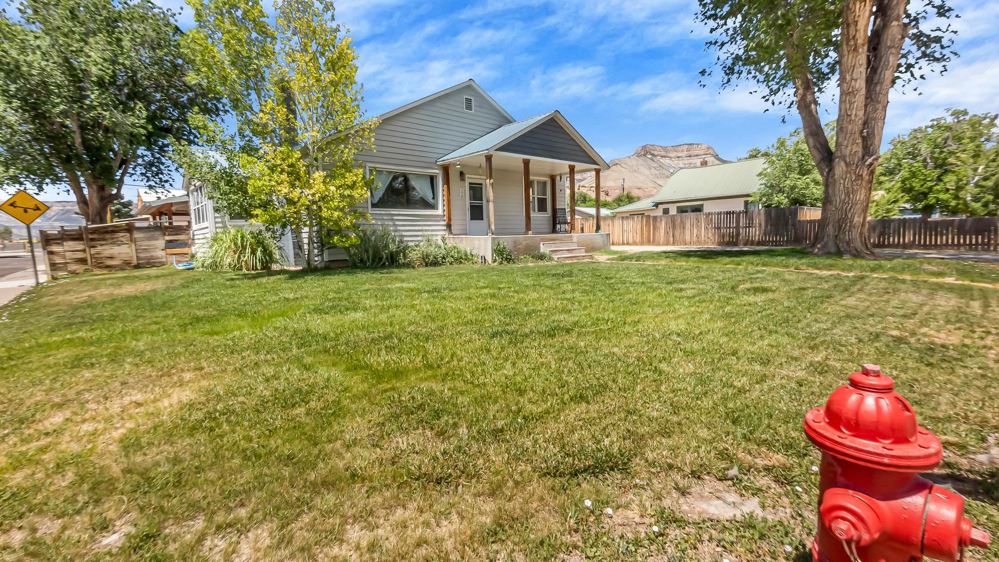 208 3rd Street Parachute, CO 81635 - Photo 33 of 40 a front view of a house with a garden