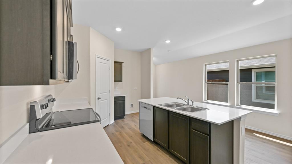 657 Glee Stem Road Lavon, TX 75166 - Photo 6 of 26 a bathroom with a sink double vanity and a tub
