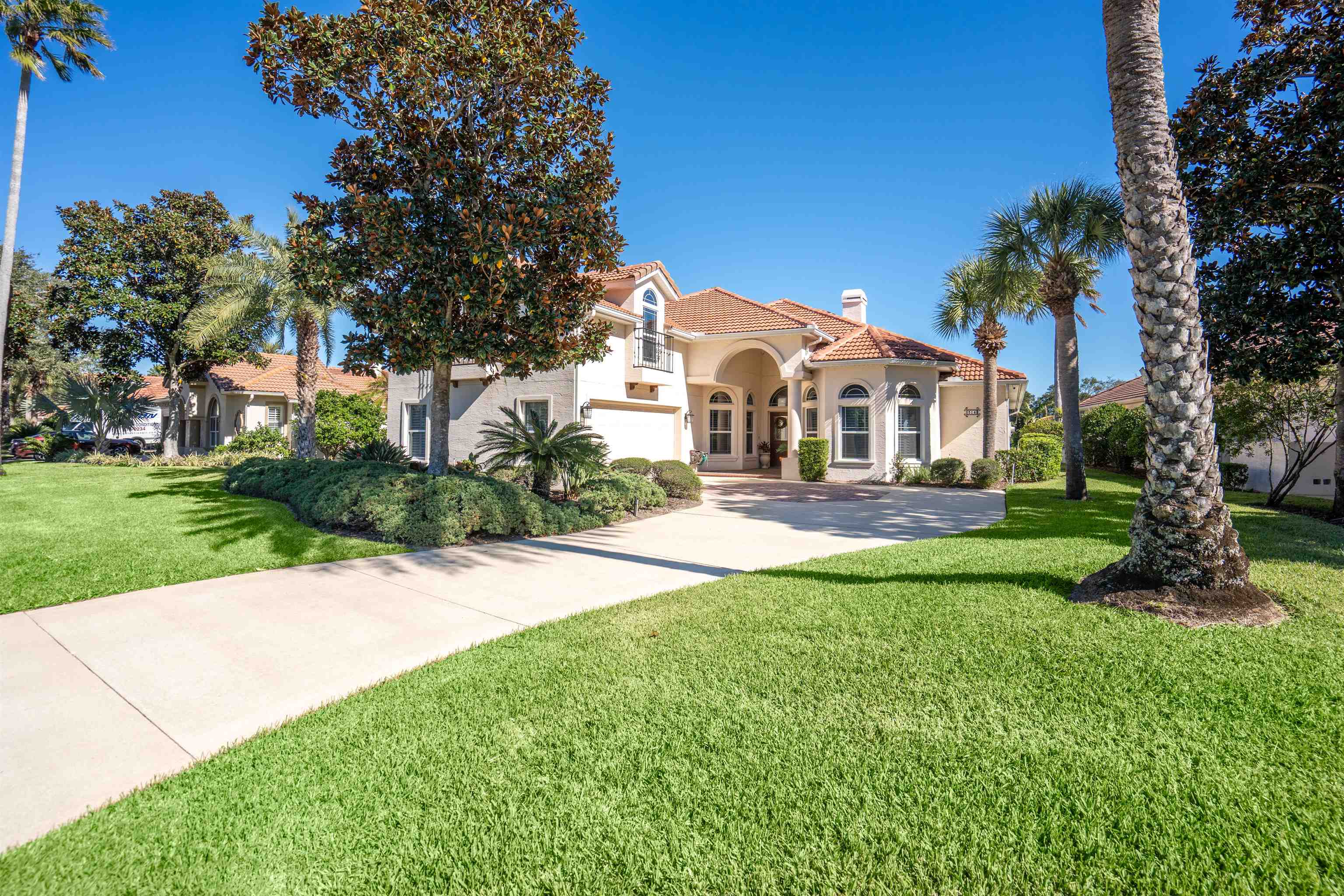 314 Fiddlers Point Drive St. Augustine, FL 32080 - Photo 1 of 54 a front view of a house with a yard