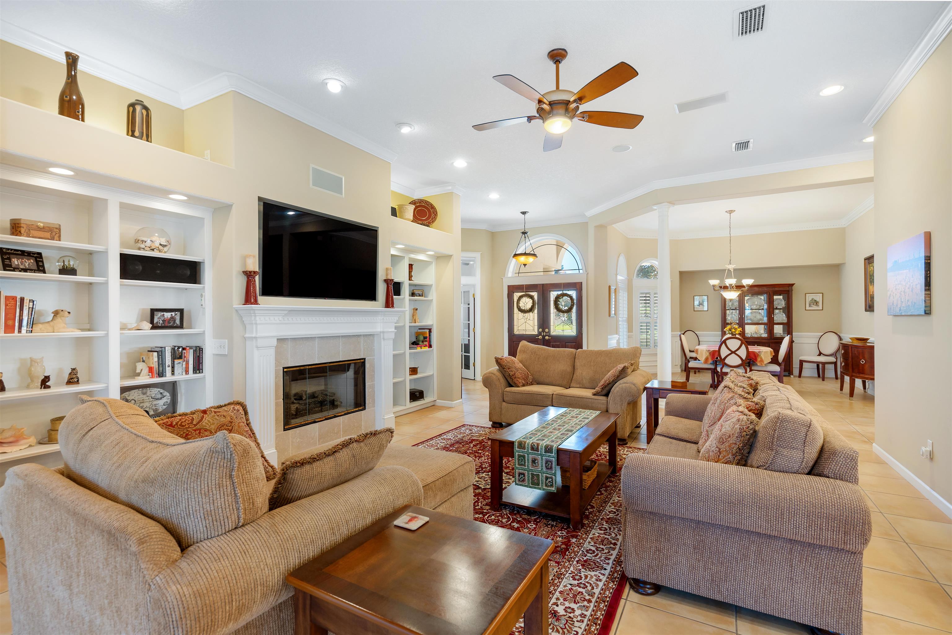 314 Fiddlers Point Drive St. Augustine, FL 32080 - Photo 11 of 54 a living room with furniture fireplace and a flat screen tv