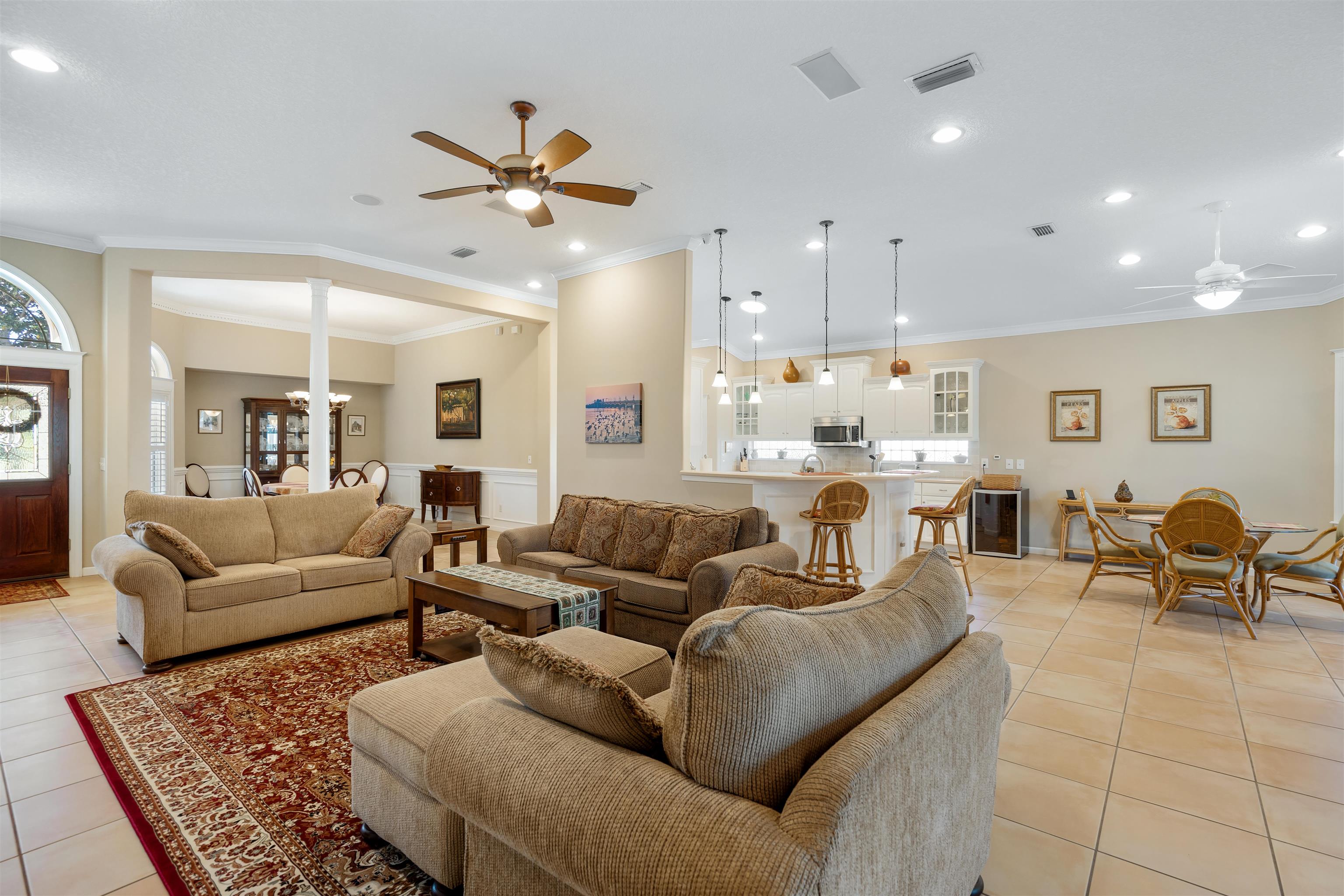 314 Fiddlers Point Drive St. Augustine, FL 32080 - Photo 12 of 54 a living room with furniture kitchen view and a chandelier