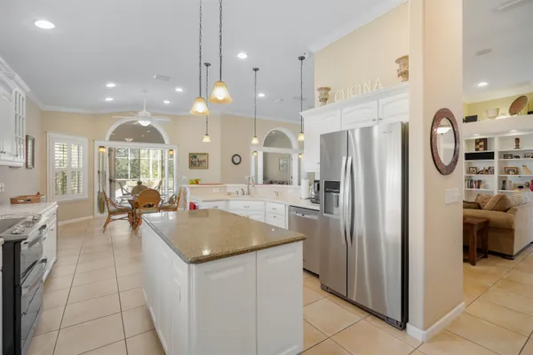 a very nice looking dining room with kitchen island furniture and a view of kitchen