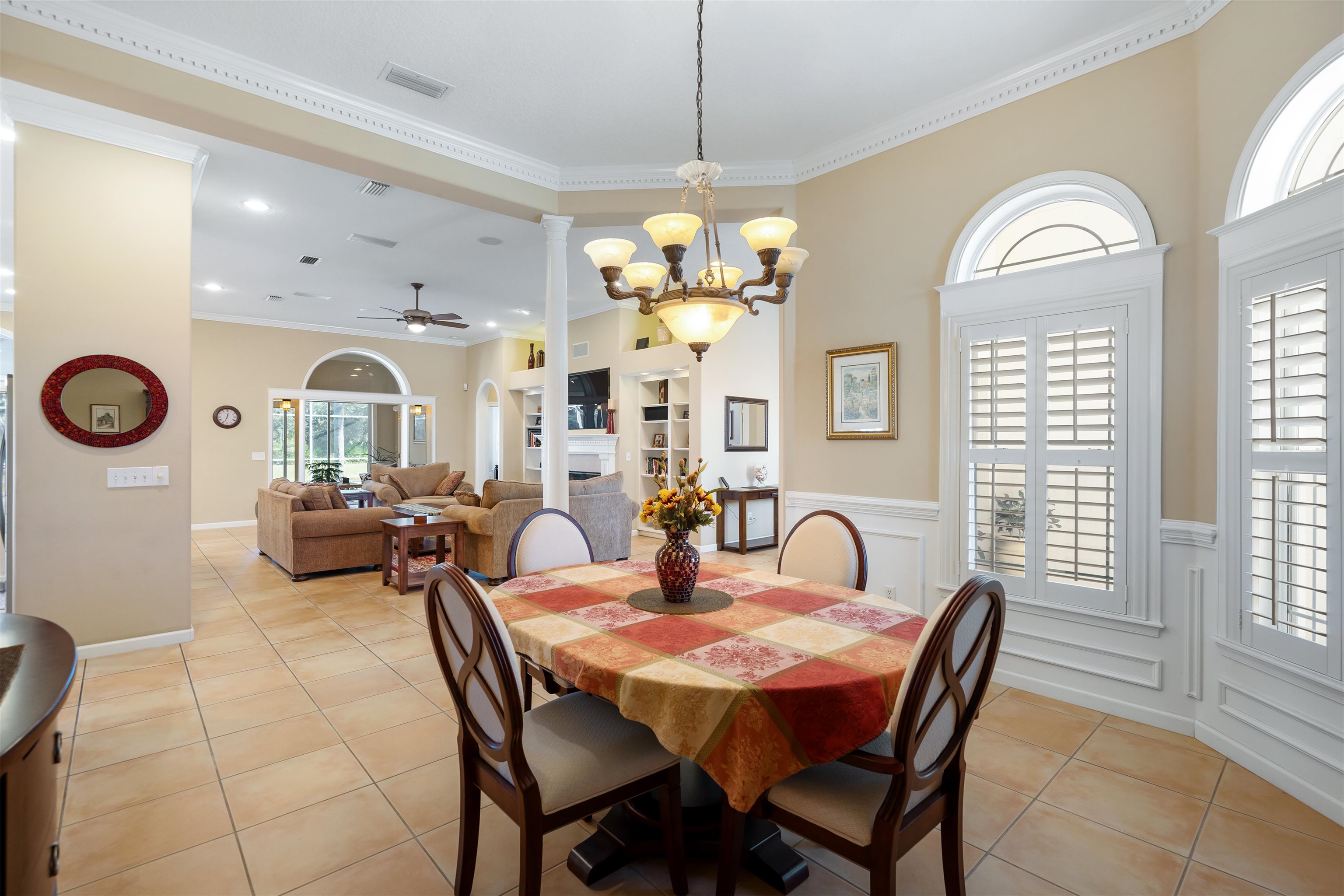 314 Fiddlers Point Drive St. Augustine, FL 32080 - Photo 16 of 54 a view of a dining room with furniture and a chandelier