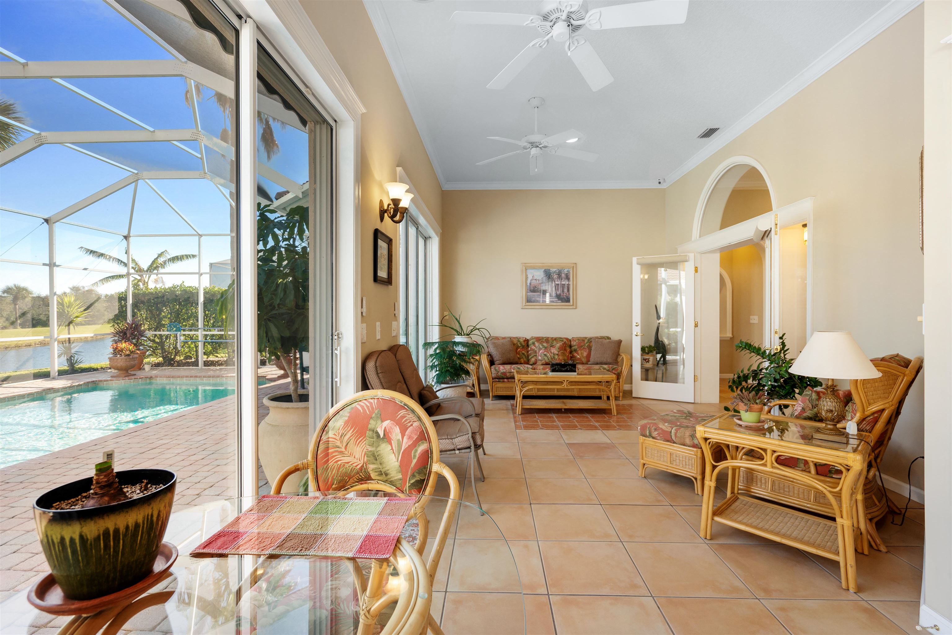 314 Fiddlers Point Drive St. Augustine, FL 32080 - Photo 20 of 54 a living room with furniture and a floor to ceiling window