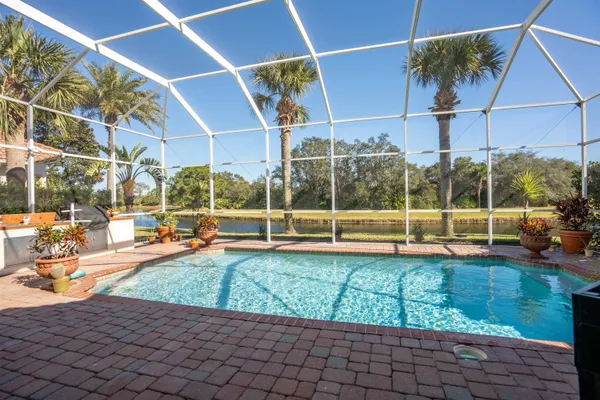 a view of a swimming pool with a patio