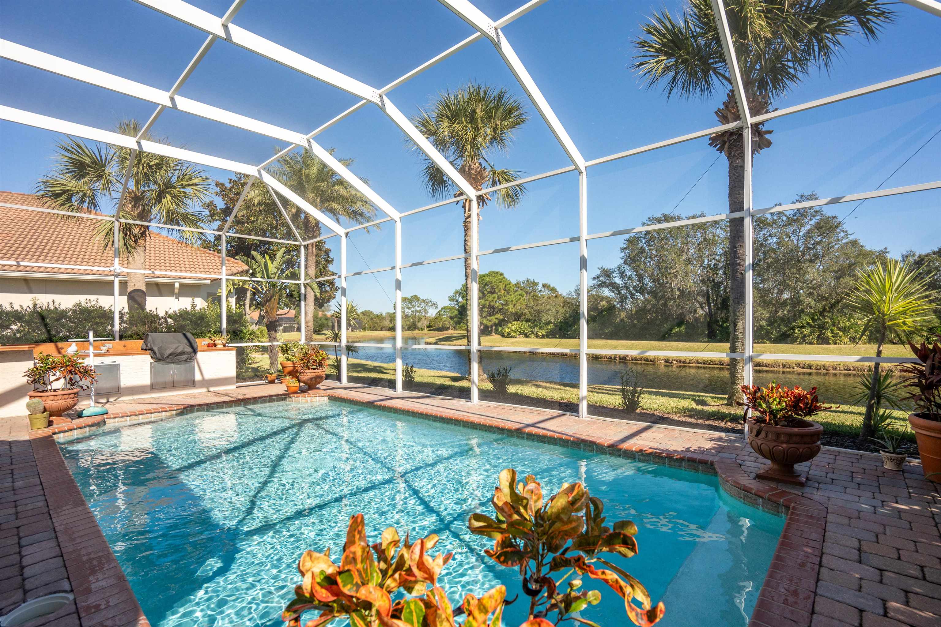 314 Fiddlers Point Drive St. Augustine, FL 32080 - Photo 23 of 54 a view of a swimming pool with a patio