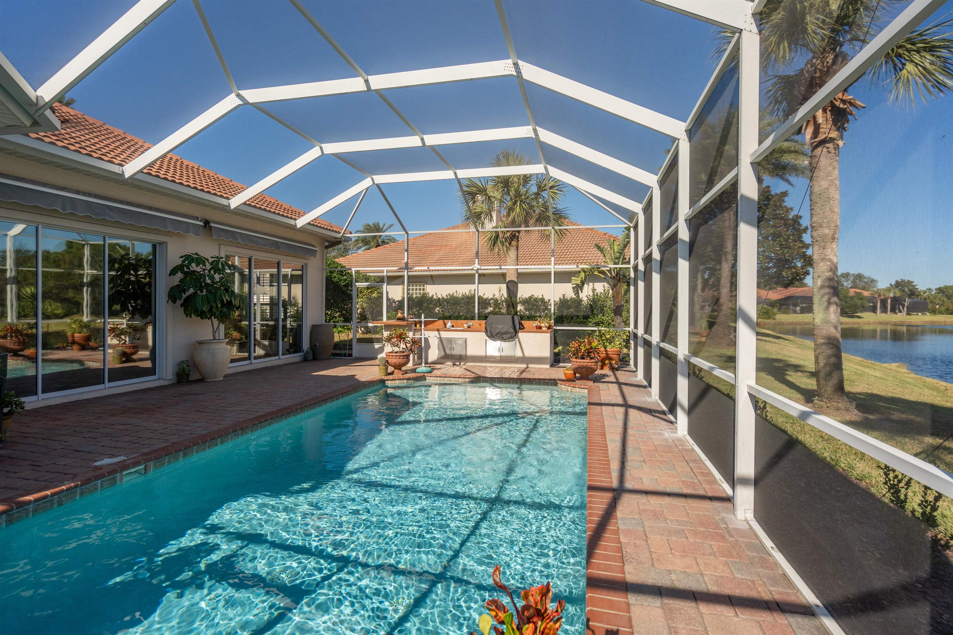 314 Fiddlers Point Drive St. Augustine, FL 32080 - Photo 25 of 54 a view of a swimming pool with a patio