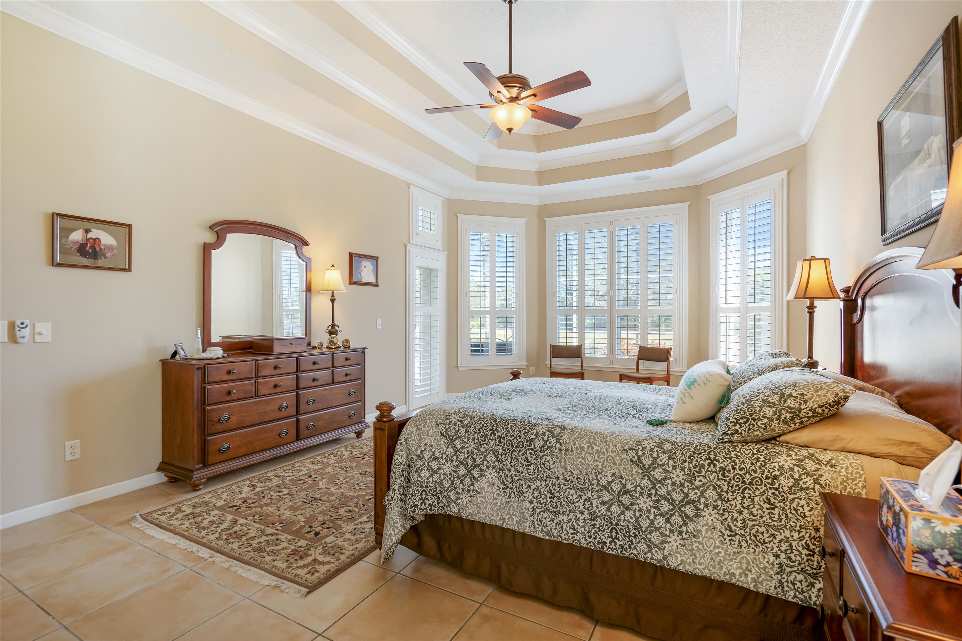 314 Fiddlers Point Drive St. Augustine, FL 32080 - Photo 27 of 54 a bedroom with a bed dresser and wooden floor