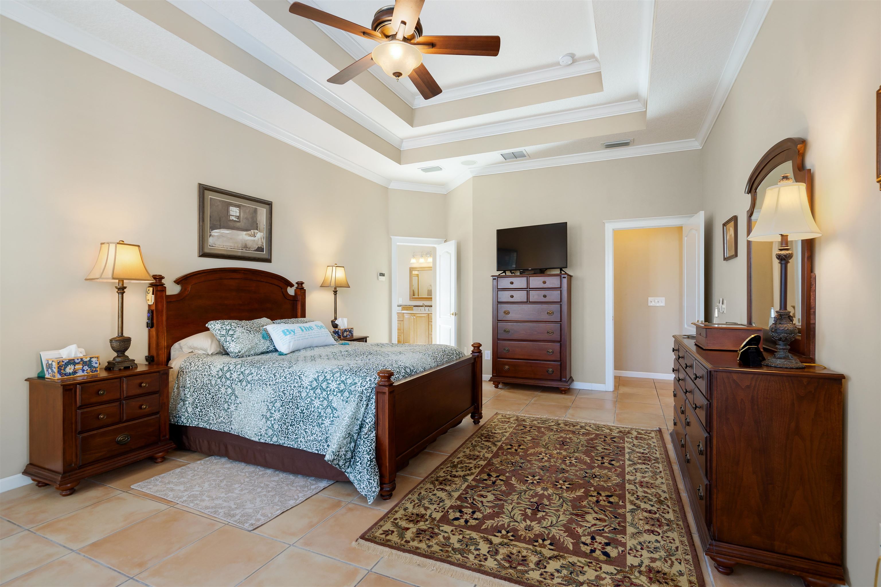 314 Fiddlers Point Drive St. Augustine, FL 32080 - Photo 28 of 54 a bedroom with a bed and a dresser