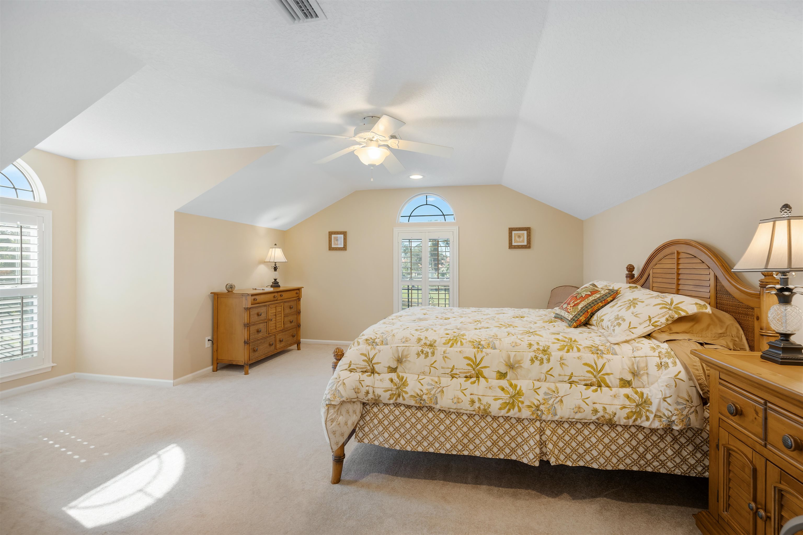 314 Fiddlers Point Drive St. Augustine, FL 32080 - Photo 38 of 54 a bedroom with a bed and a chandelier