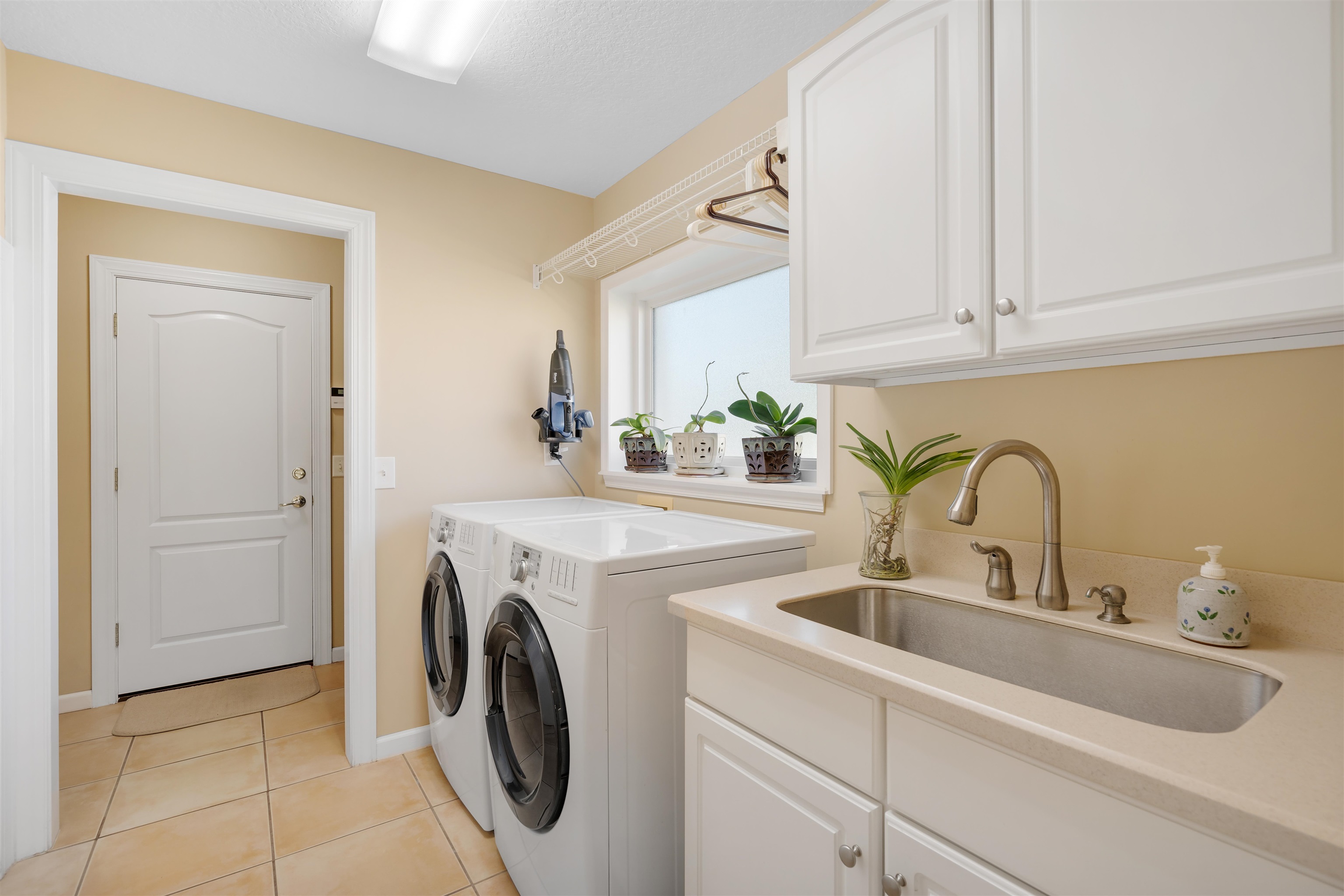 314 Fiddlers Point Drive St. Augustine, FL 32080 - Photo 41 of 54 a utility room with sink dryer and washer