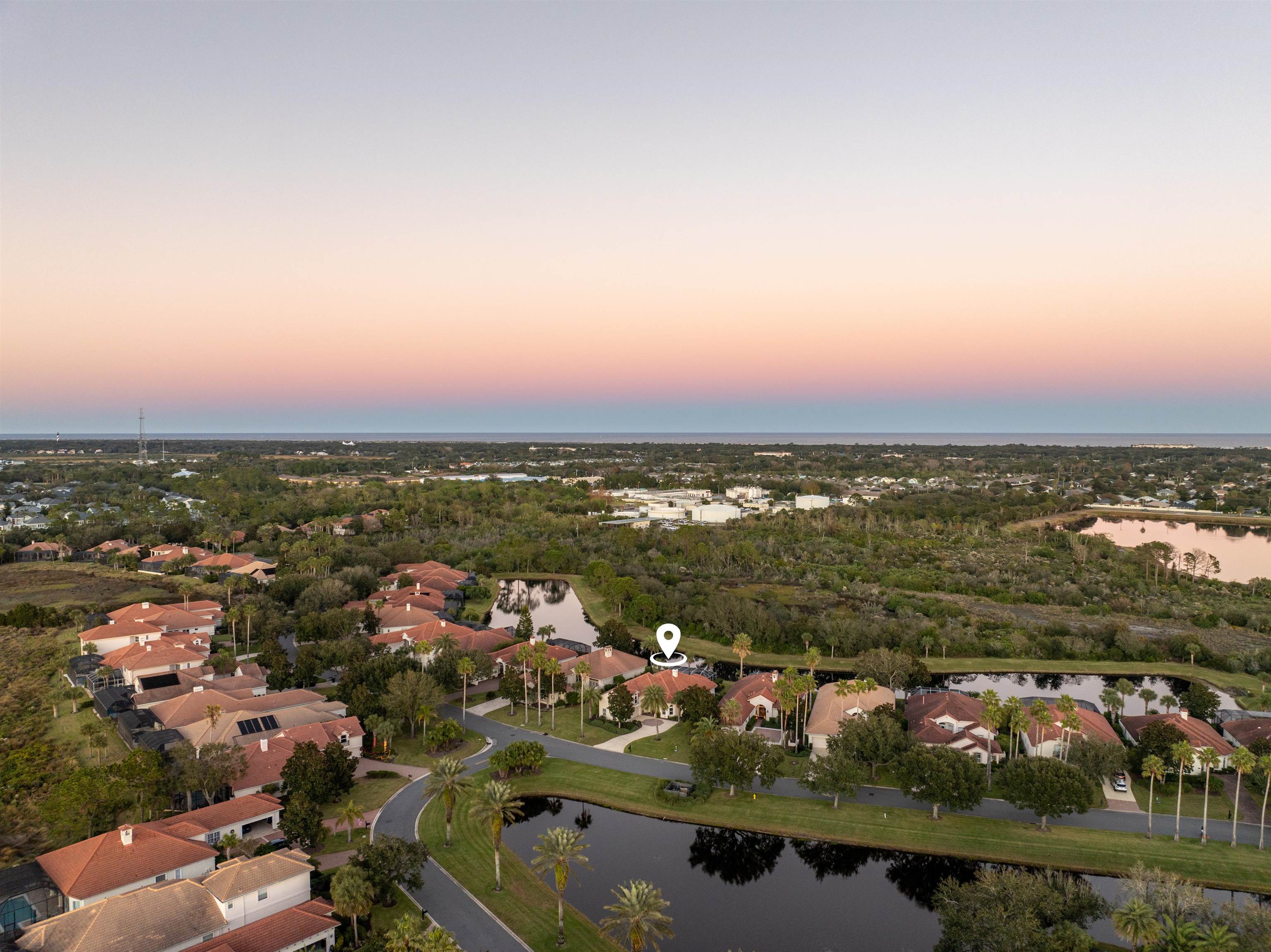 314 Fiddlers Point Drive St. Augustine, FL 32080 - Photo 51 of 54 an aerial view of a city with lots of residential buildings and ocean view in back