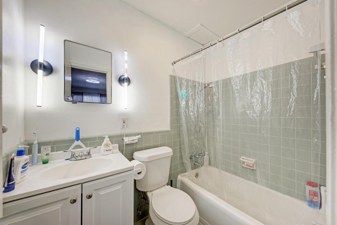 803 West 28th Street, Unit 102 Austin, TX 78705 - Photo 12 of 16 a bathroom with a sink toilet and shower