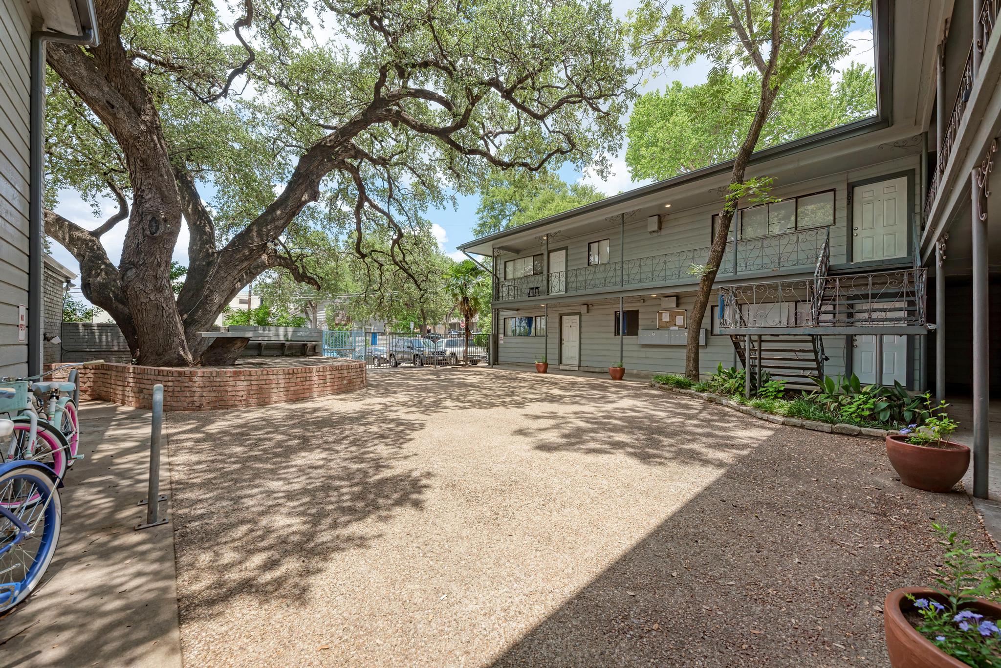 803 West 28th Street, Unit 102 Austin, TX 78705 - Photo 16 of 16 a view of a house with a yard and sitting area
