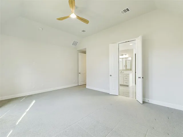 a spacious bathroom with a granite countertop sink mirror and double