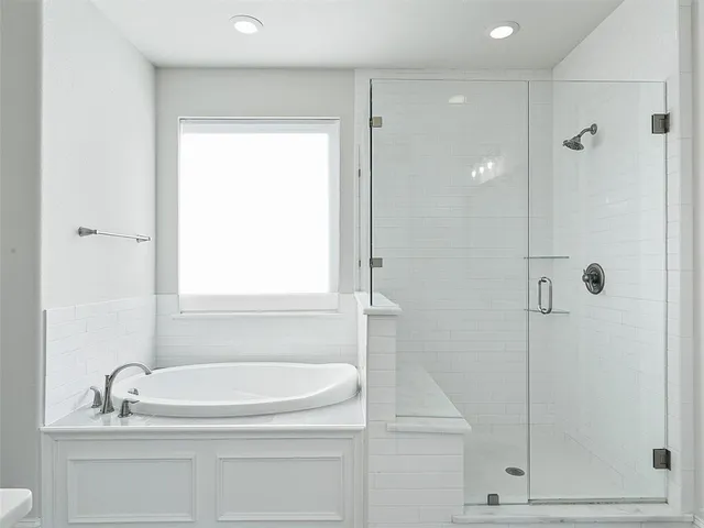 a spacious bathroom with double sink and a mirror