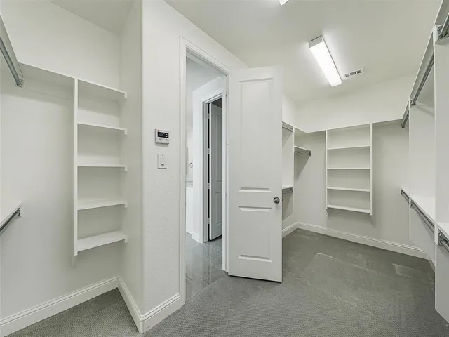 a view of a hallway with an empty room