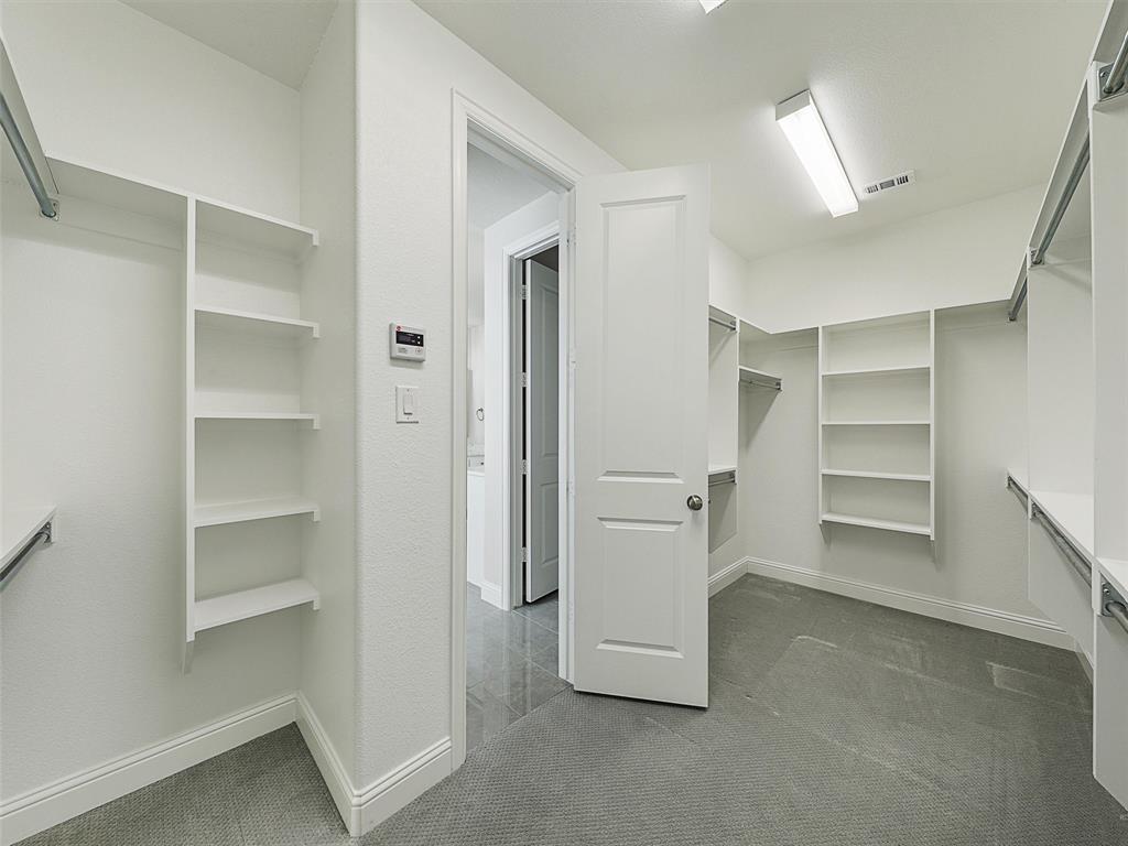 8473 Gerbera Daisy Road Frisco, TX 75035 - Photo 22 of 39 a view of an empty walk in closet