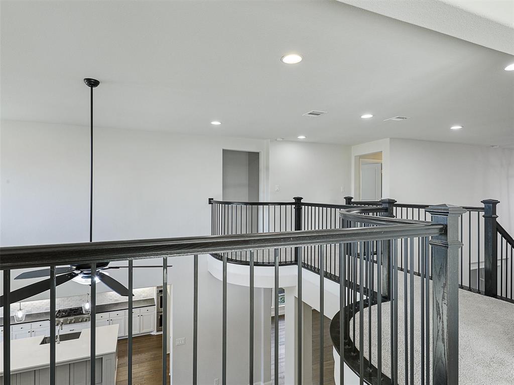 8473 Gerbera Daisy Road Frisco, TX 75035 - Photo 23 of 39 a view of a hallway with an empty room