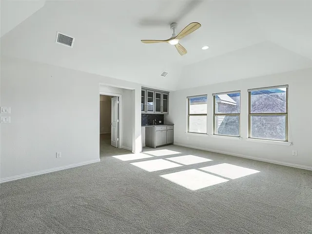 a view of cabinets and window