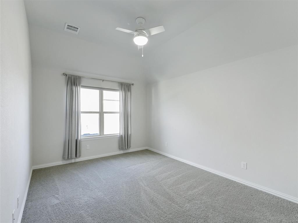 8473 Gerbera Daisy Road Frisco, TX 75035 - Photo 30 of 39 an empty room with a window