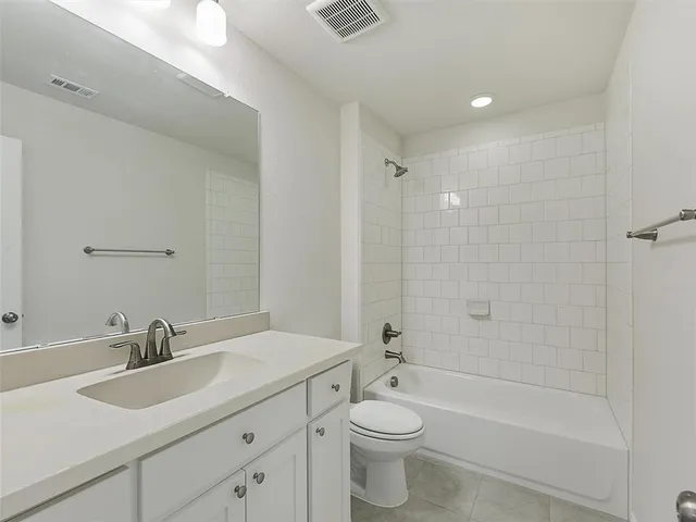 a view of cabinets and wooden floor