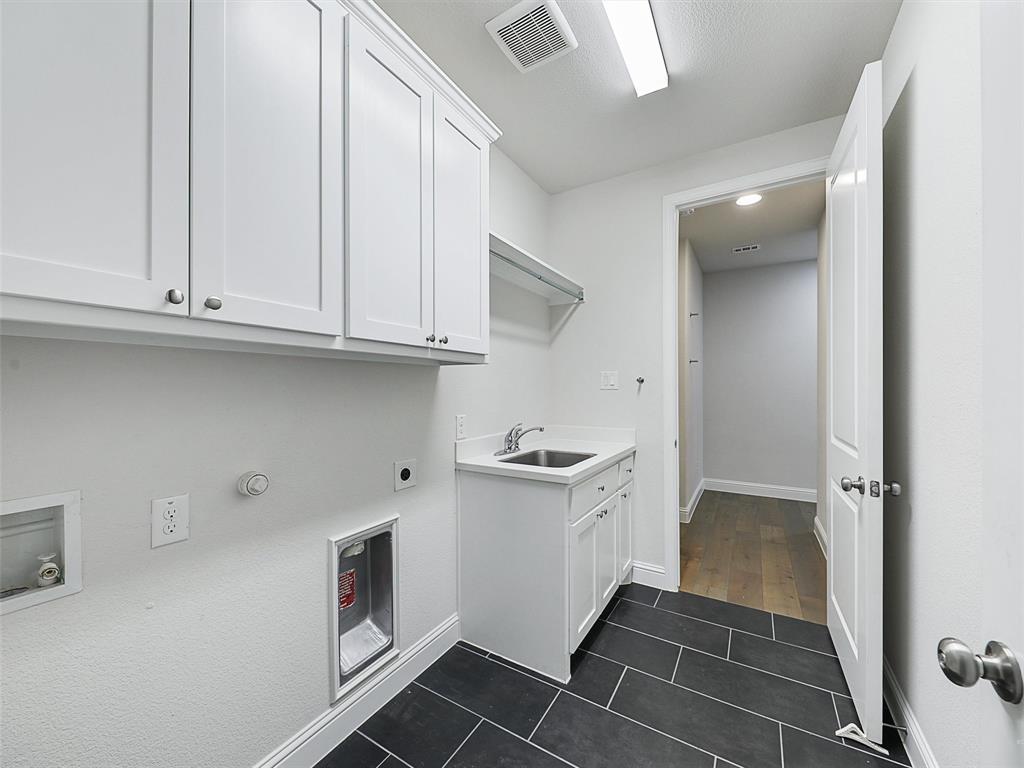 8473 Gerbera Daisy Road Frisco, TX 75035 - Photo 33 of 39 a view of cabinets and wooden floor