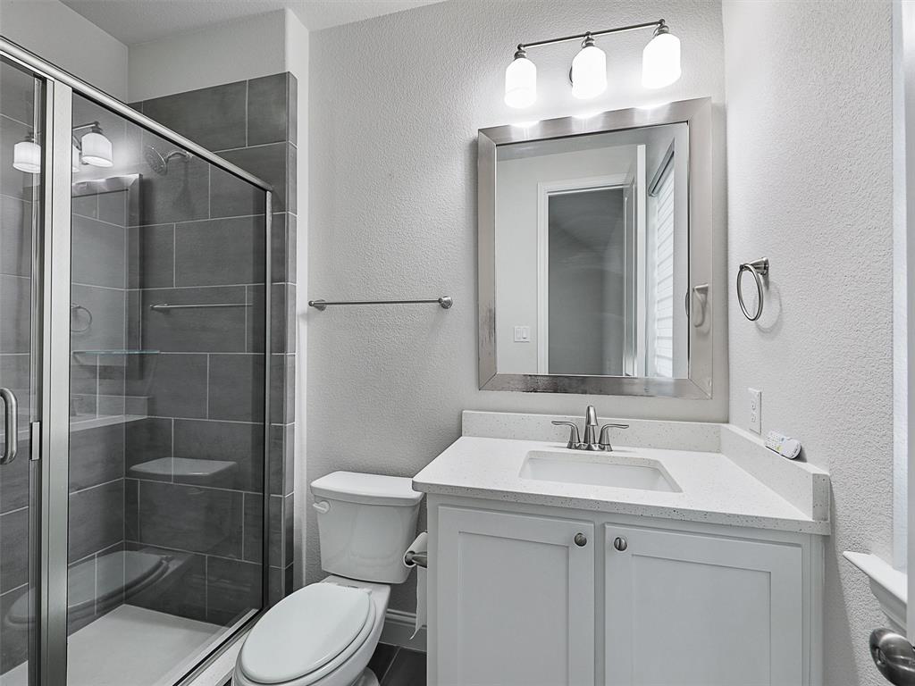 8473 Gerbera Daisy Road Frisco, TX 75035 - Photo 6 of 39 a bathroom with a sink a toilet and shower