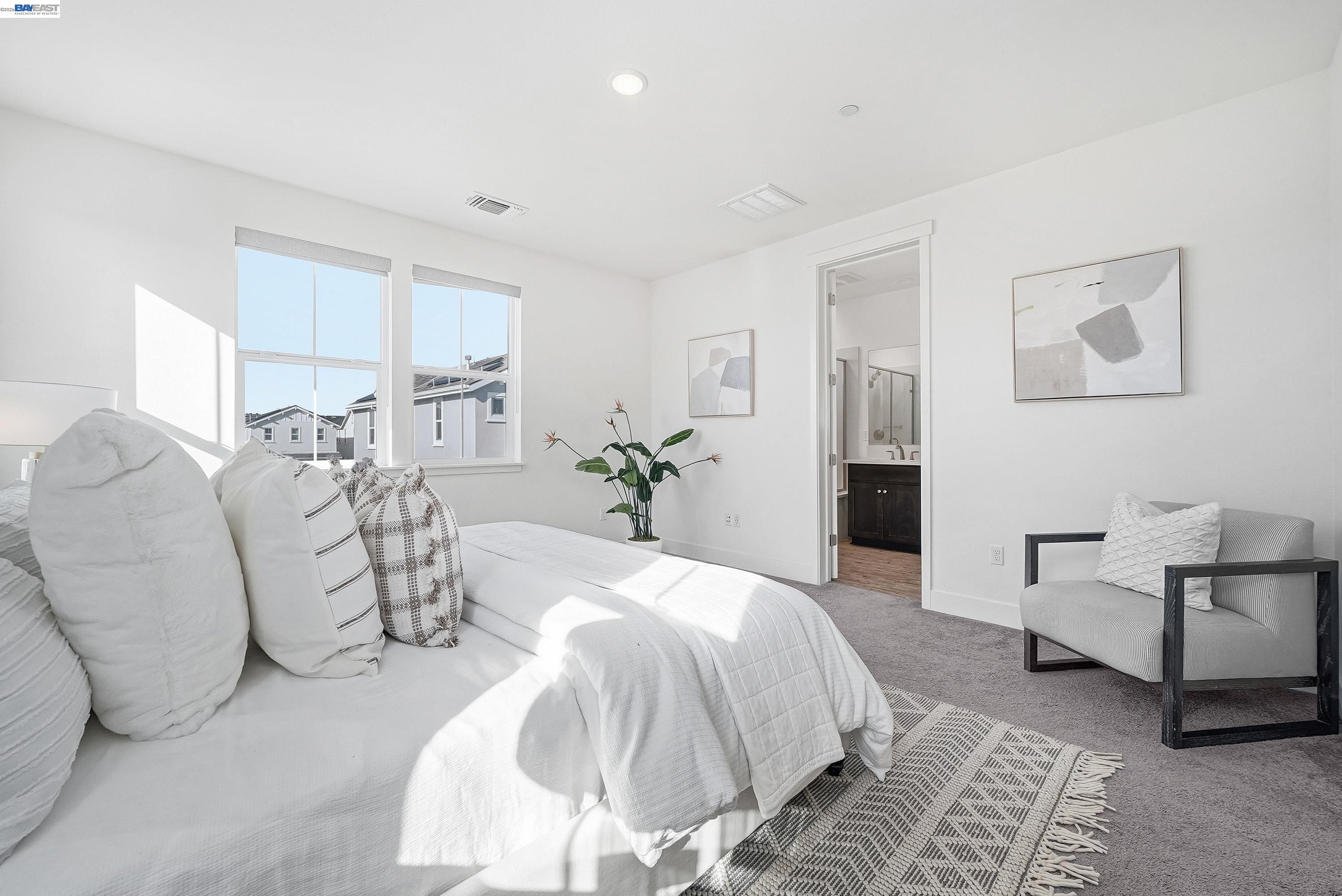 37645 Bay Crest Road Newark, CA 94560 - Photo 17 of 46 a spacious bedroom with a bed and chair