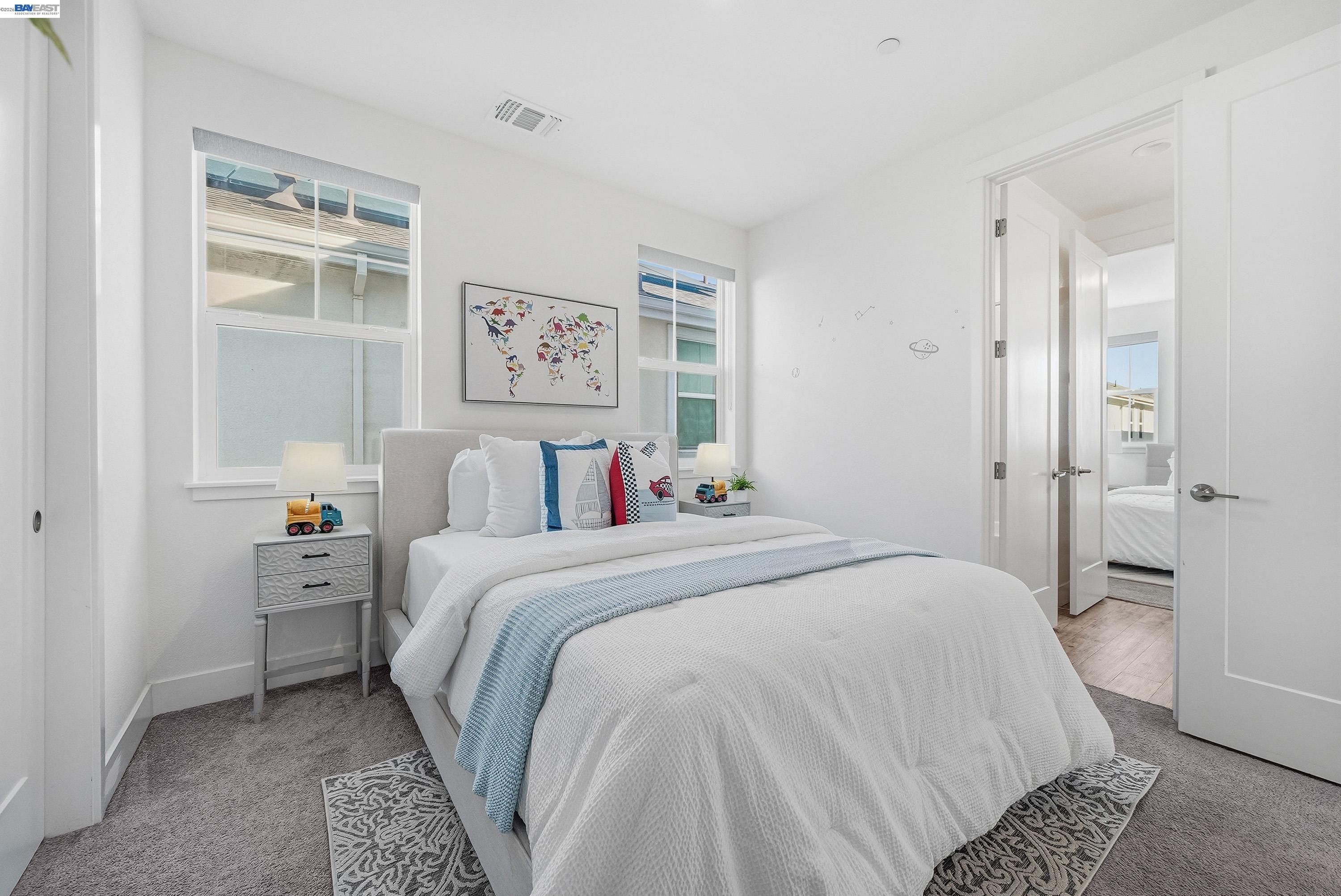 37645 Bay Crest Road Newark, CA 94560 - Photo 23 of 46 a bedroom with a large bed and a chandelier