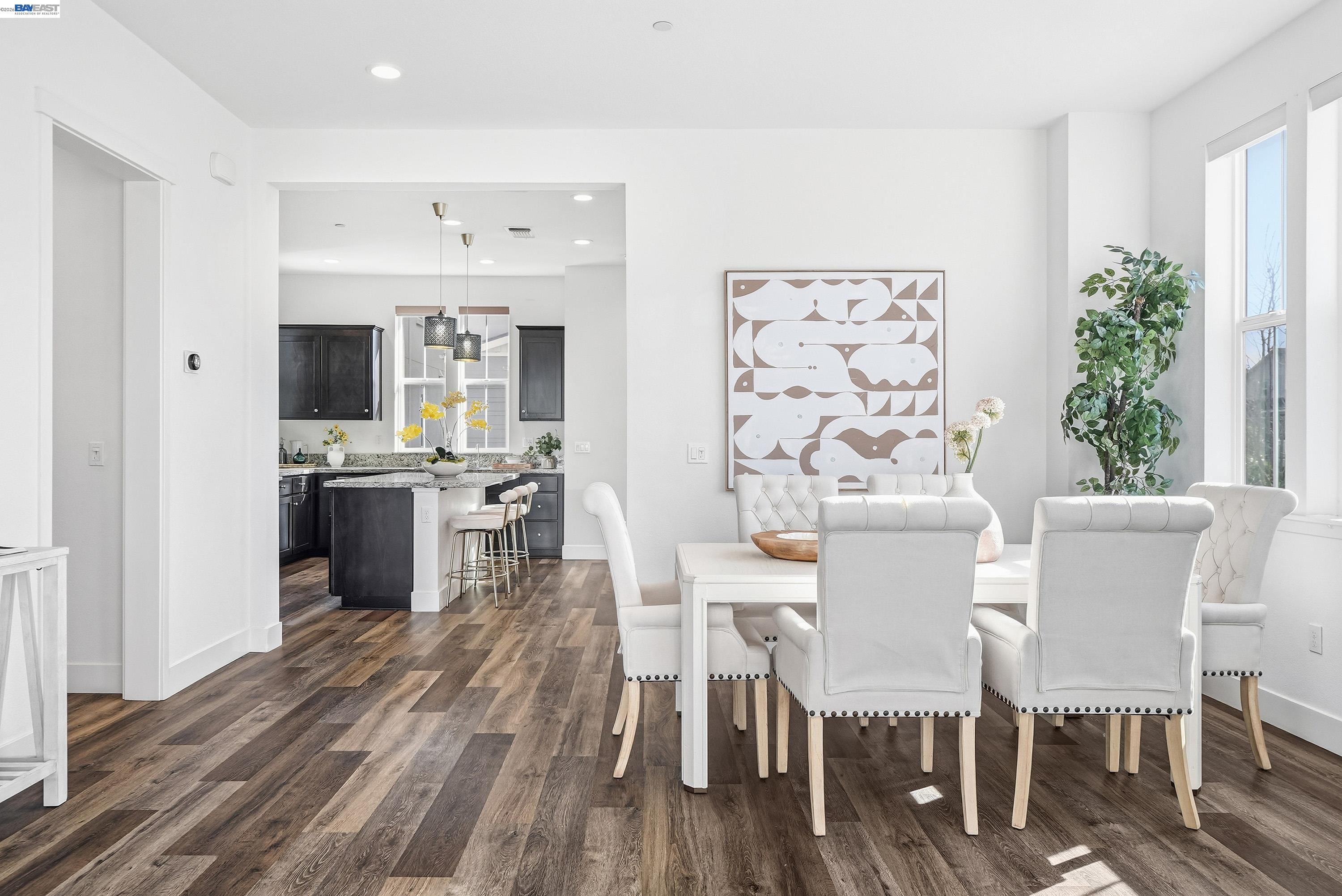 37645 Bay Crest Road Newark, CA 94560 - Photo 4 of 46 a view of a dining room with furniture and wooden floor