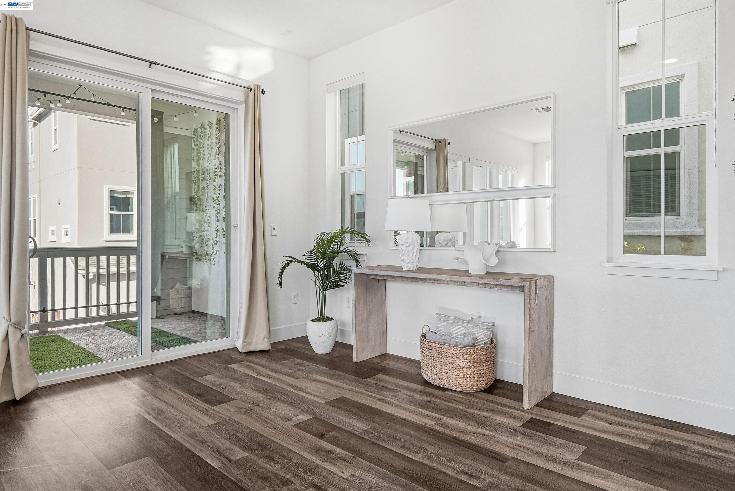 37645 Bay Crest Road Newark, CA 94560 - Photo 7 of 46 a living room with a couch and a floor to ceiling window