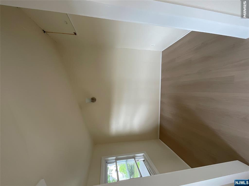 131 Delafield Avenue, Unit 3 Lyndhurst, NJ 07071 - Photo 4 of 15 an empty room with a empty space and windows