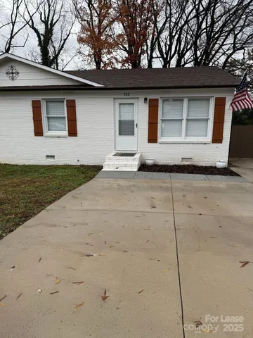 a house with trees in the background